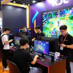 Engaging visitors at the KJC.onl booth during a vibrant global gaming expo showcasing top entertainment brands.